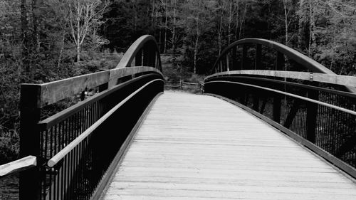 Footbridge against trees