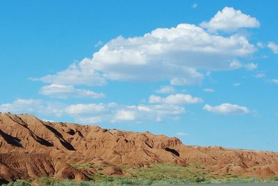 Scenic view of landscape against blue sky