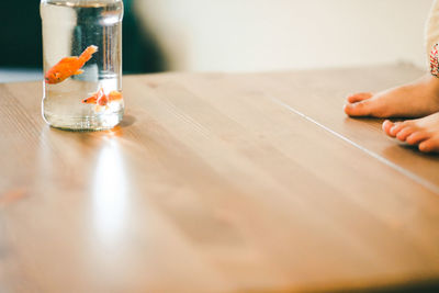 Close-up of person hand on table