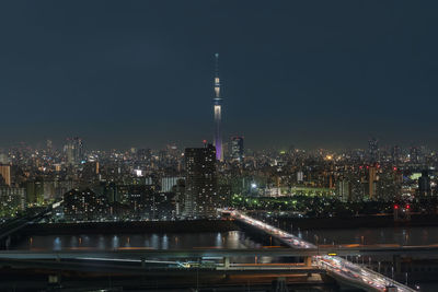 Scene of tokyo sky tree over the downtown cityscape with express way and river, japan