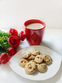 Close-up of red roses on table