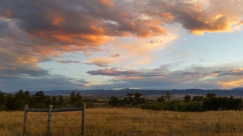 Scenic view of landscape against cloudy sky
