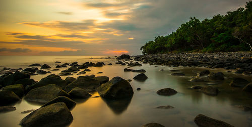 Scenic view of sea against sky at sunset