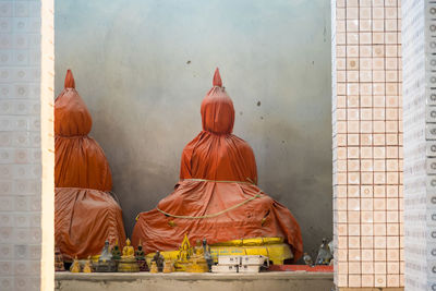 Statue of temple against building