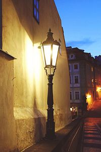 View of illuminated street lights at night