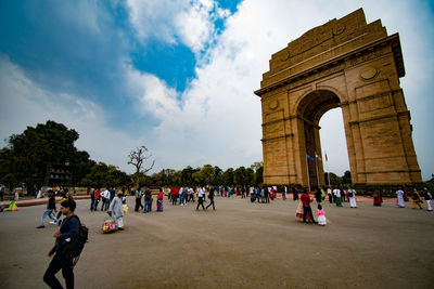 Group of people in front of historical building