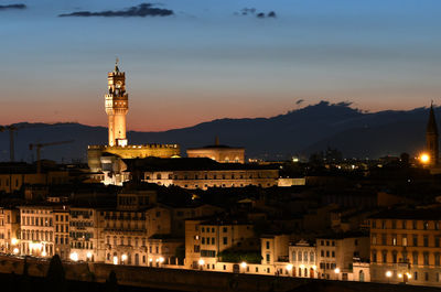 Illuminated buildings in town at night