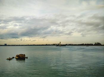 Scenic view of sea against cloudy sky