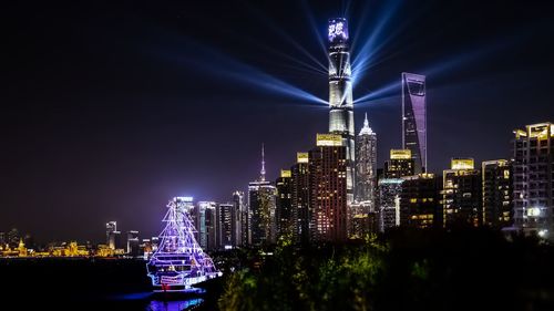 Illuminated buildings in city at night