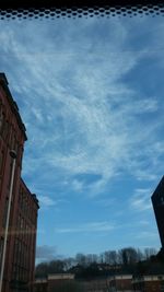 View of buildings against cloudy sky