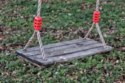 Close-up of swing hanging on rope