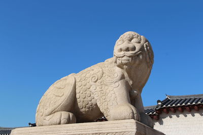 Low angle view of statue against clear sky