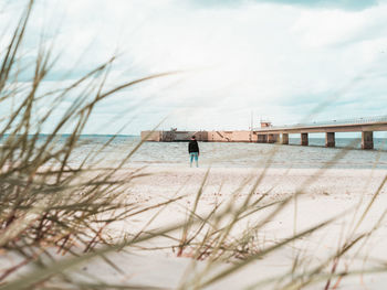 Pier over sea against sky