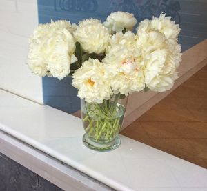 Close-up of flower vase on table at home