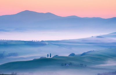 Scenic view of landscape against sky during sunset