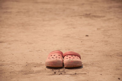 High angle view of shoes on sand