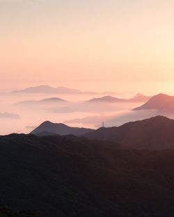 Scenic view of mountains against sky during sunset