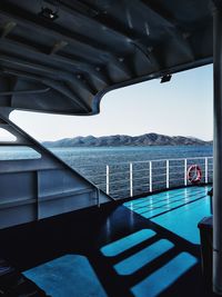 Swimming pool by sea against sky