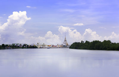 View of bridge over river against cloudy sky