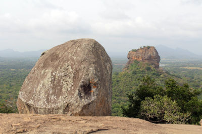 Panoramic view of rock formations against sky