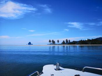 Scenic view of sea against blue sky