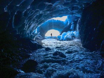 Man swimming in cave