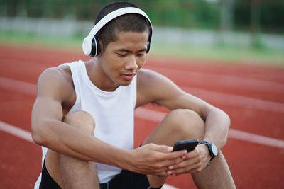 Portrait of young woman exercising in gym