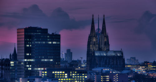 Buildings in city at night