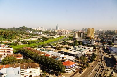 High angle view of buildings and street against sky