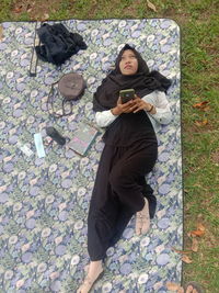 High angle view of man using mobile phone