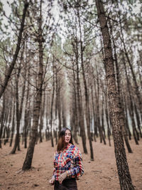 Portrait of young woman in forest