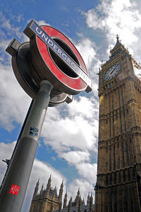 Low angle view of clock tower against sky