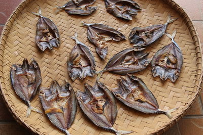 High angle view of fish on wicker basket