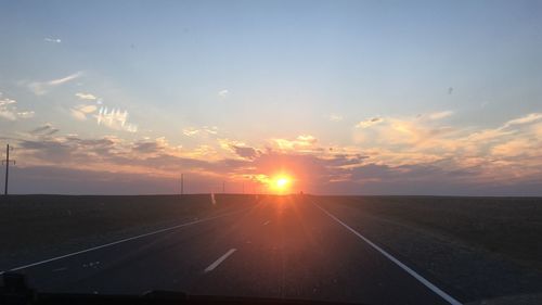 Road against sky during sunset