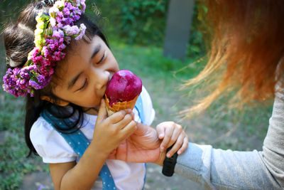 Midsection of woman holding flower