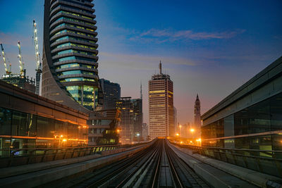 Illuminated buildings in city at night