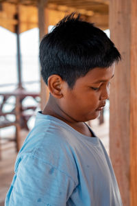 Portrait of boy standing outdoors