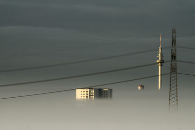 Low angle view of electricity pylon