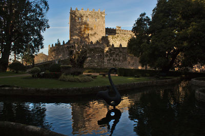 Reflection of old building in lake