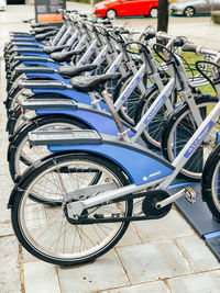 Bicycle parked on footpath in parking lot