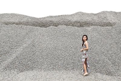 Beautiful woman standing on field