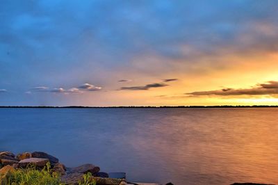 Scenic view of sea against cloudy sky