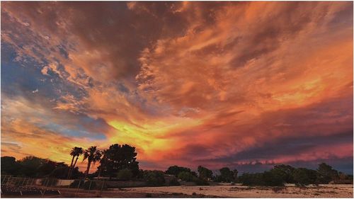 Scenic view of dramatic sky during sunset