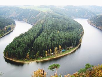 Scenic view of river with mountain in background