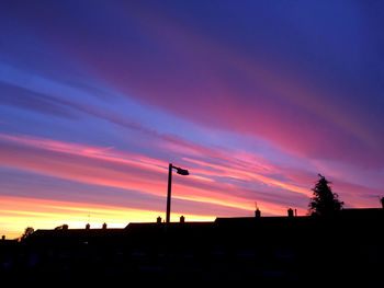 Silhouette of street against dramatic sky
