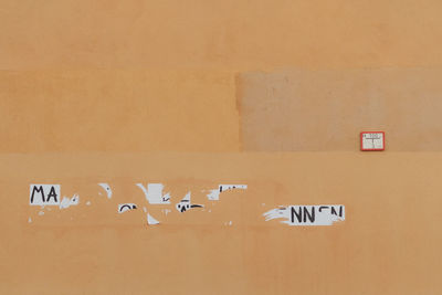 Close-up of text on wall