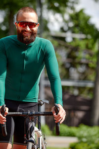 Portrait of young man riding bicycle