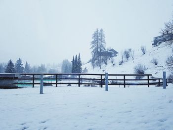 Snow covered field against sky