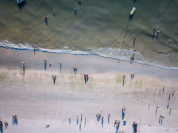Aerial view of people enjoying at beach