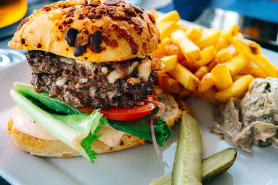 Close-up of hamburger and french fries in tray